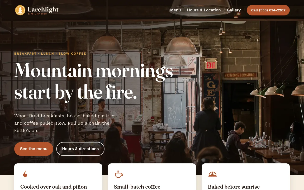 Larchlight Café & Kitchen sample design on a desktop screen: a full-bleed photo of a warm café with the headline Mountain mornings start by the fire